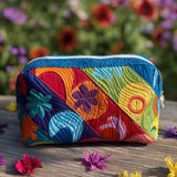 Cosmic Twist Quilted Makeup Bag – quilted makeup bag by Moira Dublin